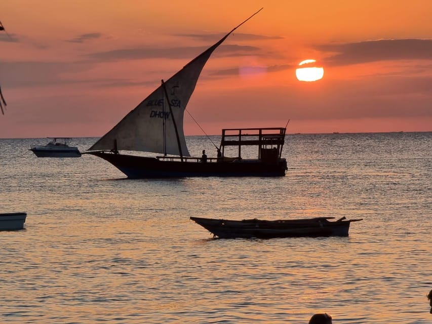 Traditional dhow sailing at sunset in Zanzibar