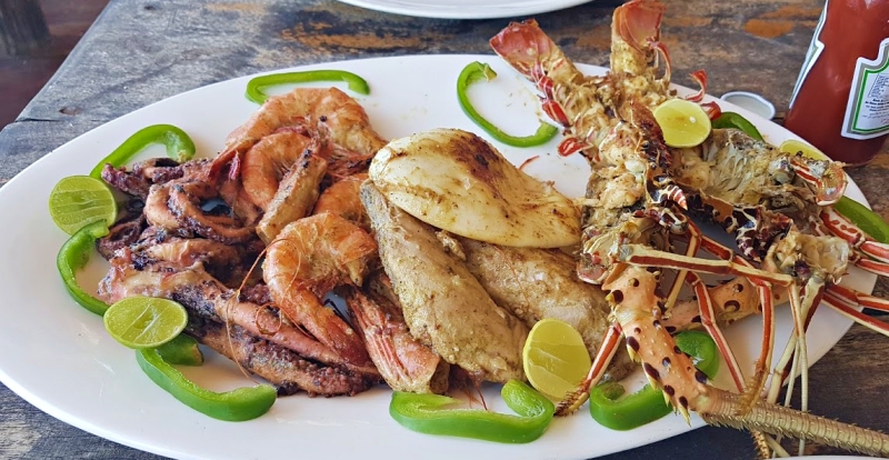 Fresh seafood barbecue on beach in Zanzibar